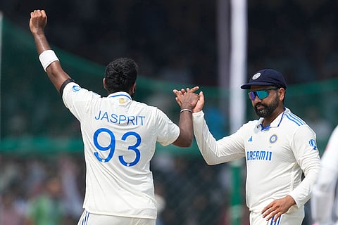 IND vs BAN, 2nd Test: India's Jasprit Bumrah, left, and India's captain Rohit Sharma celebrate the wicket of Bangladesh's Taijul Islam