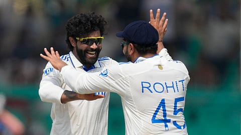 Ravindra Jadeja (left) celebrates a wicket with skipper Rohit Sharma.