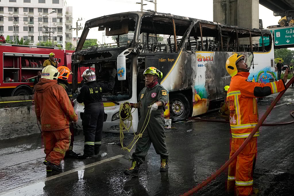| Photo: AP : School Bus Catches Fire Outside Bangkok, Over 20, Including Children, Feared Dead 