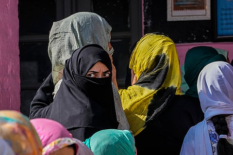 3rd phase of J&K polls: People queue up at a polling booth to cast their vote