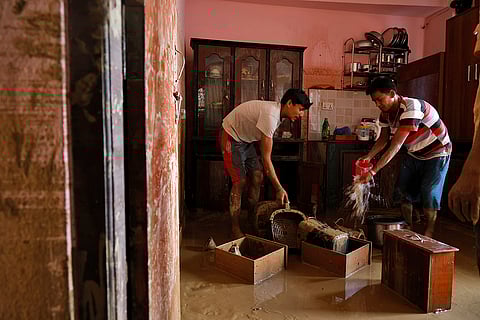 Nepal Floods: Residents clean their water-logged kitchen in Kathmandu