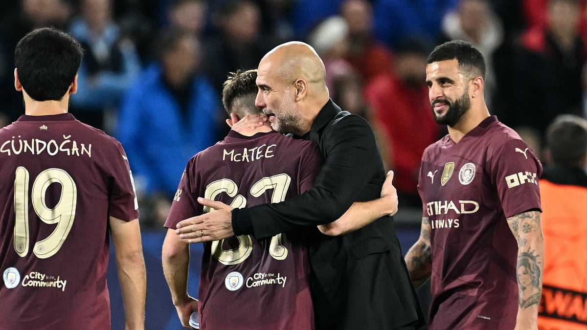 Pep Guardiola and James McAtee