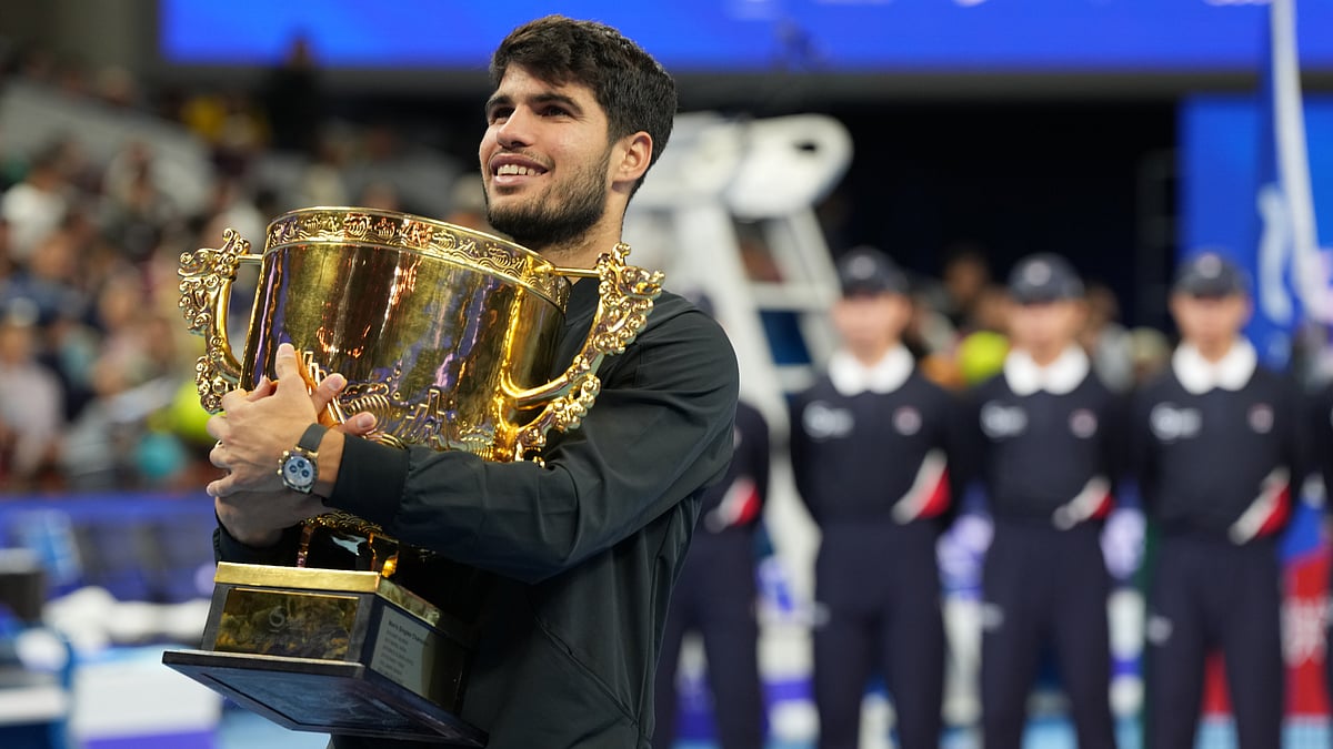 Carlos Alcaraz poses with the China Open trophy after beating Jannik Sinner - null