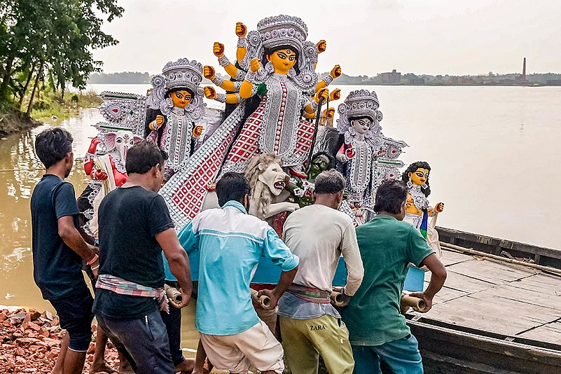 An idol of Goddess Durga being taken to puja pandal in Nadia