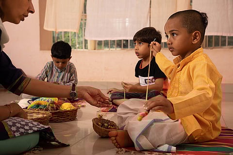 Kids taking part in Handloom Weaving