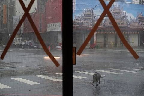 Taiwan Typhoon Krathon: A street view from a hotel that taped the glass of its front door