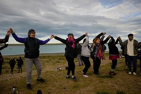 Solar eclipse 2024: People join hands during an annular solar eclipse