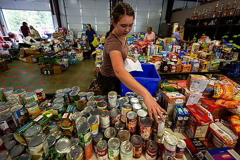 Hurricane Helene: A volunteer gathers food for families at the volunteer fire station