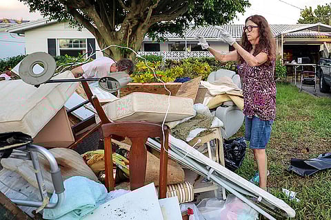 Hurricane Helene: Tammie Lockwood, a family friend of Jerome Waite, helps clears out Waite's home