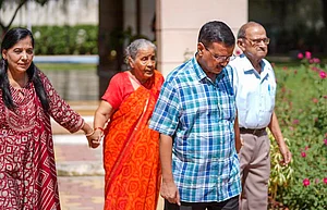 PTI : AAP National Convenor Arvind Kejriwal with his wife and parents leaves CM residence days after resigning from the chief minister's post, in New Delhi.