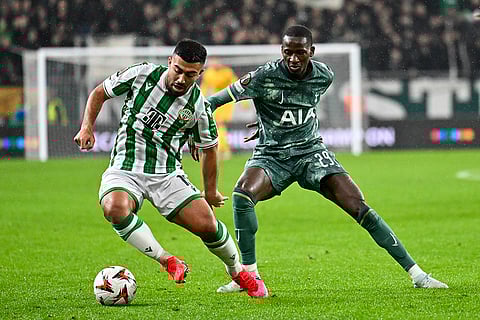 UEFA Europa League 2024-25, Ferencvaros vs Tottenham Hotspur: Ferencvaros' Mohammad Abu Fani, left, is challenged by Tottenham's Pape Matar Sarr
