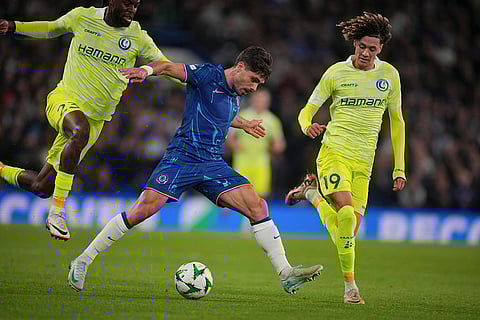 UEFA Europa Conference League 2024-25, Chelsea vs Gent: Chelsea's Pedro Neto, center, is challenged by Gent's Jordan Torunarigha and Franck Surdez