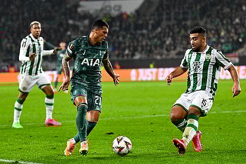 UEFA Europa League 2024-25, Ferencvaros vs Tottenham Hotspur: Tottenham's Pedro Porro is challenged by Ferencvaros' Mohammad Abu Fani