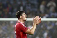 Europa League: Maguire Goal Secures A Draw For 10-Man United - In Pics | Photo: AP/Luis Vieira : UEFA Europa League 2024-25, FC Porto vs Manchester United: Manchester United's Harry Maguire applauds the fans at the end of the match