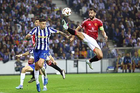 UEFA Europa League 2024-25, FC Porto vs Manchester United: Manchester United's Bruno Fernandes, right, reaches for the ball too high and close to the head of Porto's Nehuen Perez