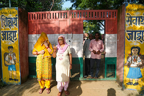 Haryana Assembly elections: Voters leave a polling station after casting their votes in Charkhi Dadri district