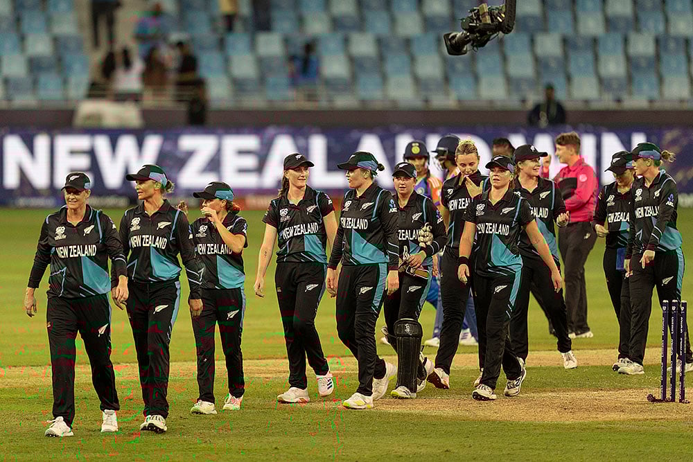 | Photo: AP/Altaf Qadri : Women's World T20 Cricket, India vs New Zealand: New Zealand team members walk back after they beat India