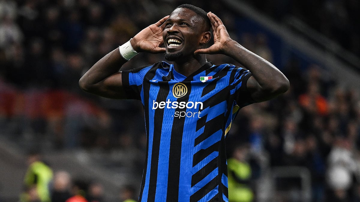 Marcus Thuram celebrates scoring a hat-trick for Inter