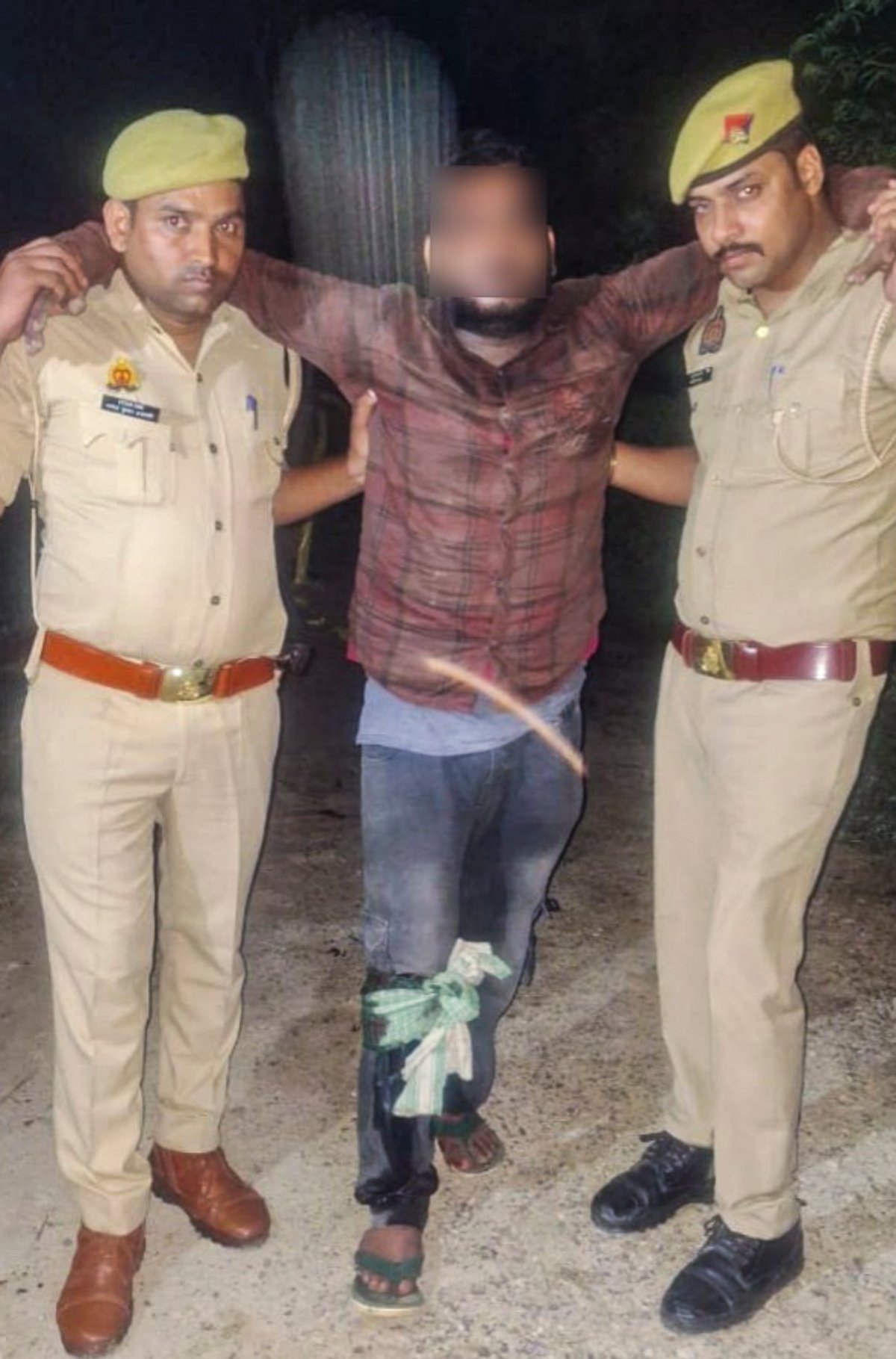 Police take away Chandan Verma after he sustained injuries on his right leg following an encounter with the police early Saturday morning, Oct. 5, 2024. - PTI