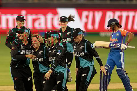 Women's World T20 Cricket, India vs New Zealand: New Zealand team members congratulate Eden Carson, third from left, after she took the wicket of India's Smriti Mandhana