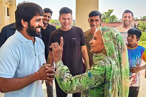 Haryana Assembly elections: Wrestler Bajrang Punia interacts with people