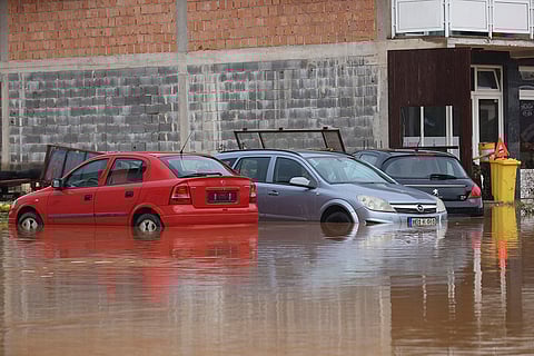 Bosnia Floods: Vehicles are partially submerged in flood waters in the village of Kiseljak
