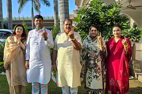 Haryana Assembly elections: Jannayak Janta Party (JJP) leader Dushyant Chautala and his family members show their fingers marked with indelible ink