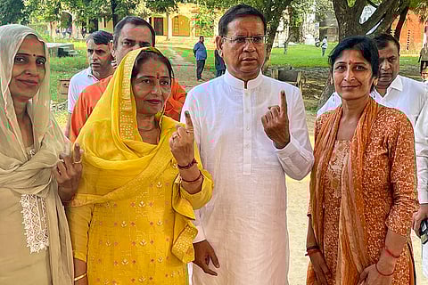 Haryana Assembly elections: BJP candidate Rajesh Nagar and his family members show their inked fingers after casting their votes