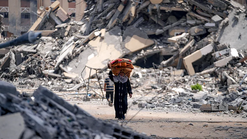 A Palestinian woman flees Hamad City