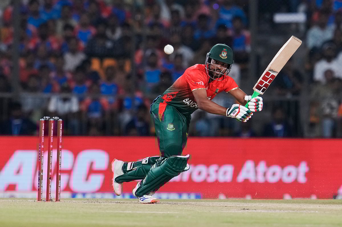 (AP Photo/Manish Swarup) : Bangladesh's captain Najmul Hossain Shanto plays a shot during the first T20 cricket match between Bangladesh and India in Gwalior, India, Sunday, Oct. 6, 2024. 