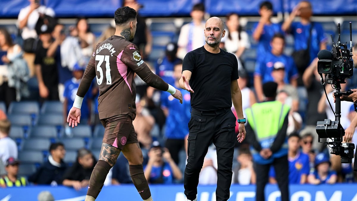 Manchester City goalkeeper Ederson, with manager Pep Guardiola