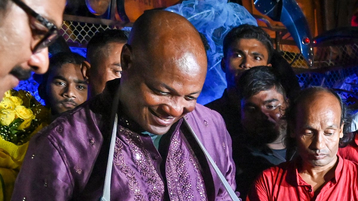 (PTI Photo) : Kolkata: Former West Indies cricketer Brian Lara plays an instrument during his visit to a community puja pandal amid the Durga Puja festivities at Suruchi Sangha, in Kolkata, Sunday, Oct. 6, 2024. 