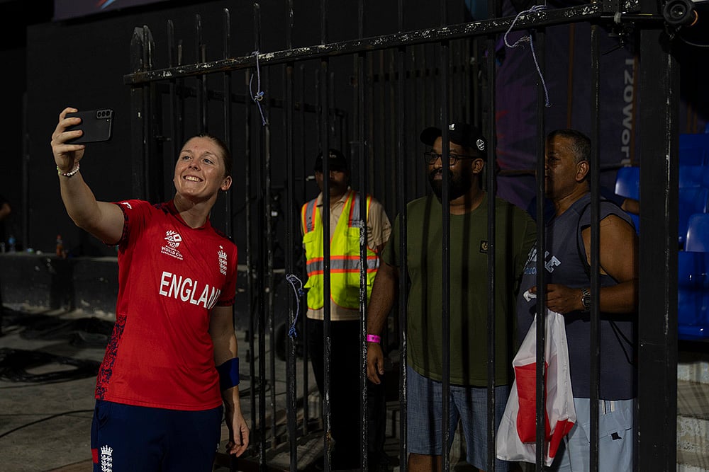 | Photo: AP/Altaf Qadri : Women's T20 World Cup, ENG W vs RSA W: England's captain Heather Knight takes selfies with her fans