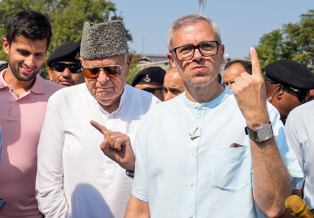 Omar Abdullah and Farooq Abdullah after casting their vote