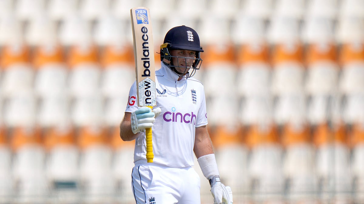 AP Photo/Anjum Naveed : England's Joe Root celebrates after scoring a fifty during the third day of the first test cricket match between Pakistan and England, in Multan.