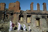 Baramulla: A Tale Of Love And History   Getty Images : Students walk home past burned homes June 10, 2002 in Baramulla