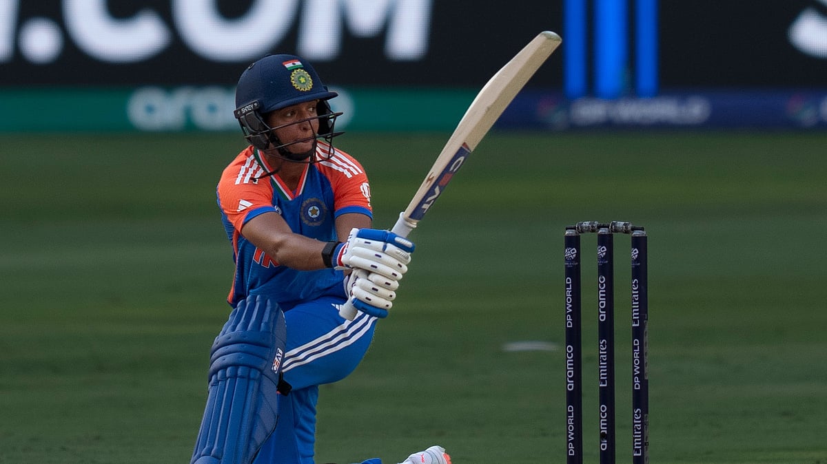 AP Photo/Altaf Qadri : India's captain Harmanpreet Kaur bats during a match.