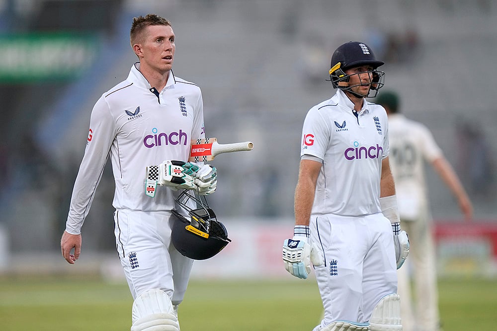 | Photo: AP/Anjum Naveed : PAK Vs ENG, 1st Test Day 2: Zak Crawley, left, and Joe Root walk off the field