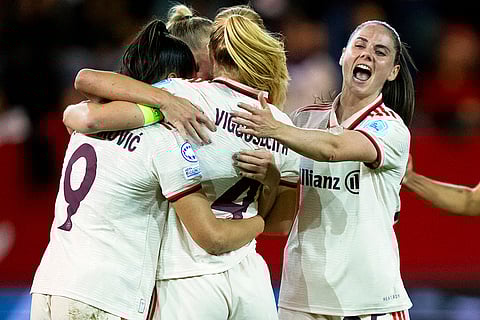 Women's Champions League: Munich's Jovana Damnjanovic, scorer Glodis Perla Viggosdottir, and Sarah Zadrazil celebrate ther side's first goal