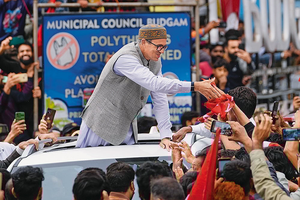 Free Hand?: Omar Abdullah with supporters after winning the elections - Photo: AP
