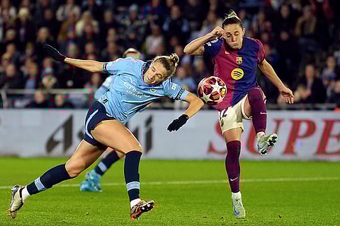 Women's Champions League: Manchester City's Vivianne Miedema, left, and Barcelona's Ona Batlle, right, challenge for the ball