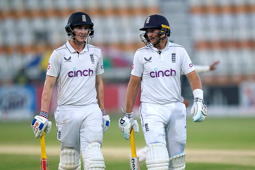 | Photo: AP/Anjum Naveed : Pakistan vs England: England's Harry Brook, left, and Joe Root walk off the field
