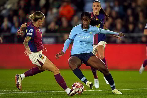 Women's Champions League: Manchester City's Khadija Shaw, right, and Barcelona's Mapi Leon, left, challenge for the ball