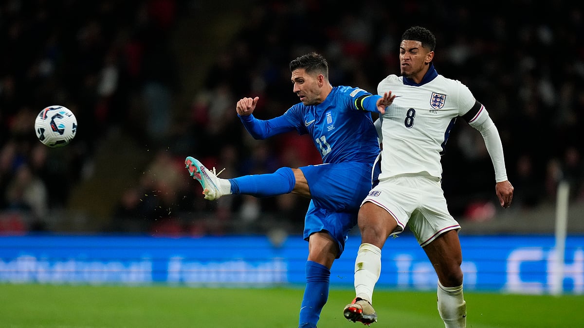 Greeces Tasos Bakasetas and Jude Bellingham challenge for the ball. AP Photo