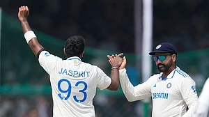 | Photo: AP/Ajit Solanki : IND vs BAN, 2nd Test: India's Jasprit Bumrah, left, and India's captain Rohit Sharma celebrate the wicket of Bangladesh's Taijul Islam
