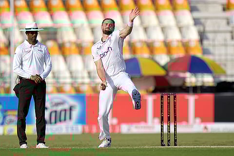 Pakistan vs England: England's Chris Woakes, center bowls during the fourth day