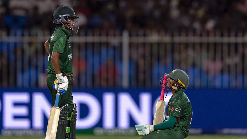 Bangladeshs Sobhana Mostary, right, sits on the pitch. AP Photo
