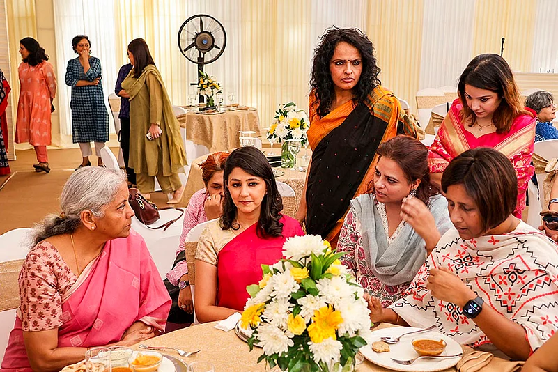 FM Nirmala interacts with women journalists in the backdrop of Varalakshmi Puja