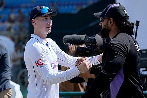 Pakistan vs England 1st Test: Harry Brook, left, is congratulated by a team official