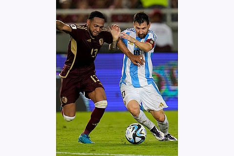 FIFA World Cup 2026 Qualifiers: Argentina's Lionel Messi, right, and Venezuela's Jose Martinez battle for the ball